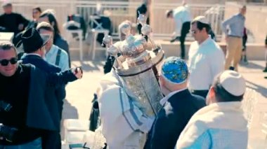 A Jewish man walks with a Torah scroll during the Torah scroll ceremony. Israel-Jerusalem-19.01.2023