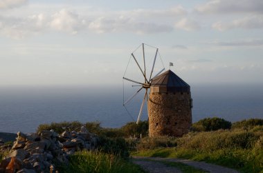 View of the backcountry of Elounda, Crete, Greece with flowers or windmills
