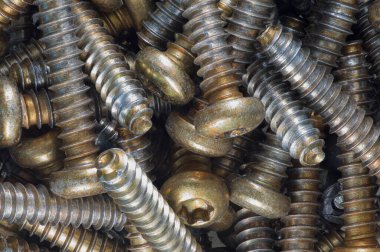 Close up of pile of metal screws clipart