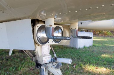 Underside of abandoned airplane. This is landing lights and pitot tubes on front landing gear clipart