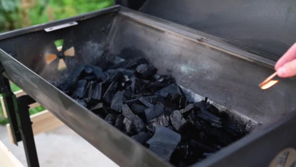 Man Lights Grill Burning Match Falls Coals Sets Them Fire — Vídeo de Stock