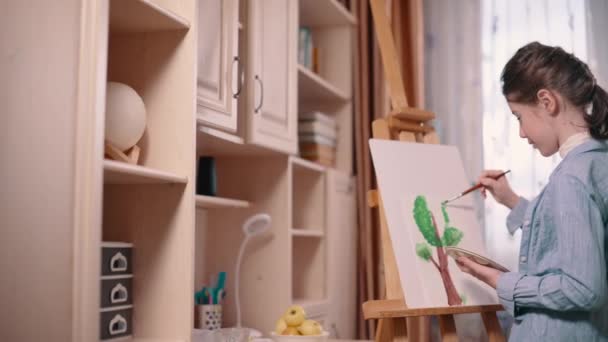 Teenager Girl Paints Tree Paper Home Slider Medium Shot — Stock Video
