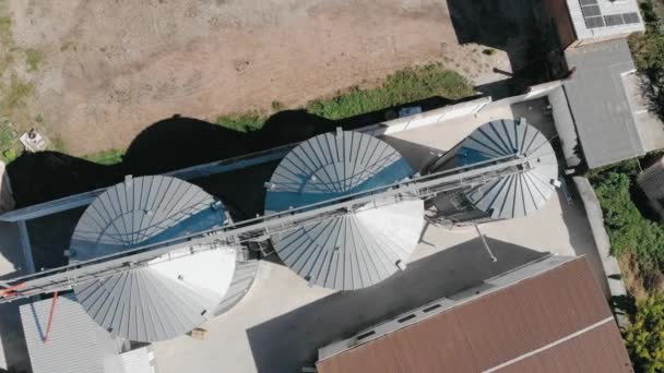 Grain Storage Aerial View Camera Descends Rotating Steel Tanks Factory — Video