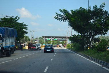 A Road Direction Board on National Highway 37 of Assam showing distance of places