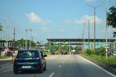 A Road Direction Board on National Highway 37 of Assam showing distance of places