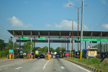 A Road Direction Board on National Highway 37 of Assam showing distance of places