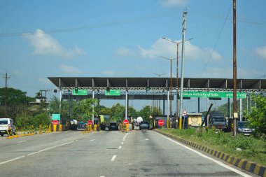 A Road Direction Board on National Highway 37 of Assam showing distance of places
