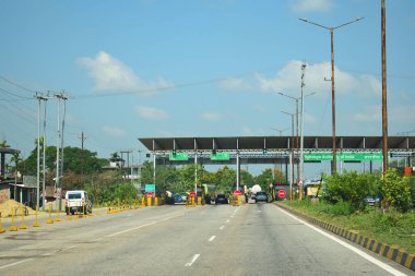 A Road Direction Board on National Highway 37 of Assam showing distance of places