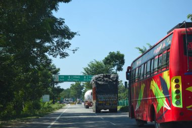 A Road Direction Board on National Highway 37 of Assam showing distance of places