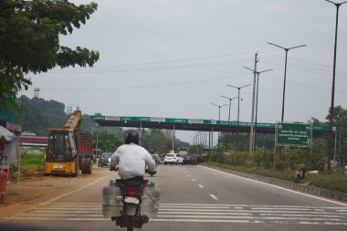 A Road Direction Board on National Highway 37 of Assam showing distance of places