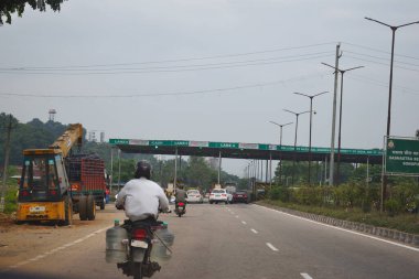 A Road Direction Board on National Highway 37 of Assam showing distance of places