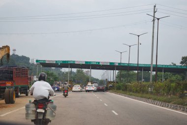 A Road Direction Board on National Highway 37 of Assam showing distance of places