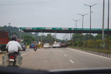 A Road Direction Board on National Highway 37 of Assam showing distance of places