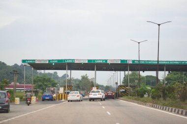A Road Direction Board on National Highway 37 of Assam showing distance of places