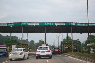 A Road Direction Board on National Highway 37 of Assam showing distance of places