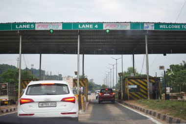 A Road Direction Board on National Highway 37 of Assam showing distance of places