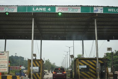 A Road Direction Board on National Highway 37 of Assam showing distance of places