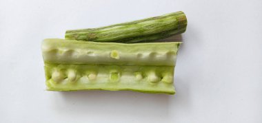 Healthy green vegan super food- Fresh harvested organic Moringa, Limaran, ben-oil, drum stick, horseradish tree, or Malunggay  vegetable. In Indonesia this vegetable is called Sayur Klentang.