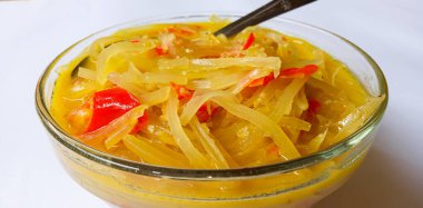 Lodeh pepaya muda, dish with coconut milk sauce is one of the side dishes in Indonesia which is made from unripe papaya on a white background.  Suitable for the lunch menu eaten with warm rice.