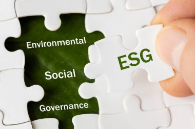 ESG environmental, social and governance concept. ESG word on a puzle, Idea for sustainable development of the organization. take into account the environment, society and corporate governance