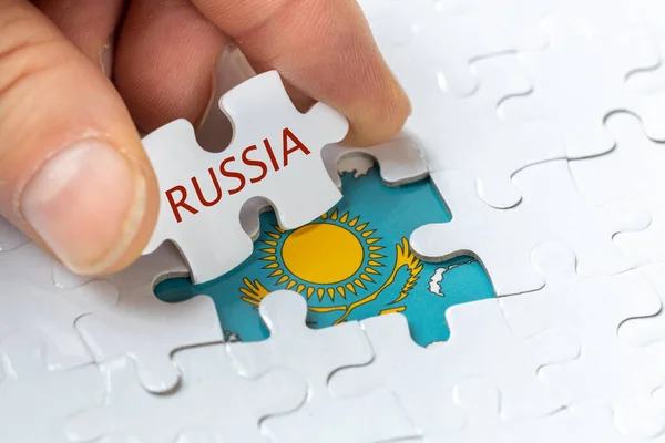 Puzzle Reveals Flag Kazakhstan Inscription Russia Concept Mutual Relations Both — Fotografia de Stock