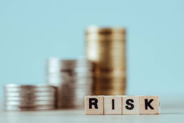 Risk word with stack coins, financial risk concept. market research, business unknown Return on investment, start in business