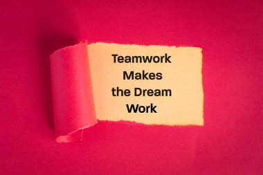 teamwork makes dream work, Creative teamwork, achievements, gaining experience, achieving a goal, Motivational slogan, appearing behind torn paper in viva magenta, Business concept
