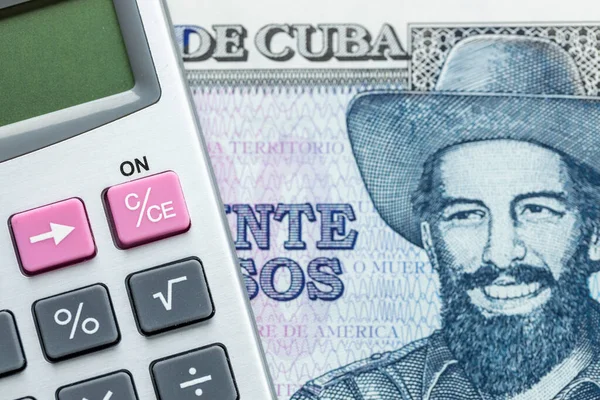 stock image Calculator and Cuban 20 pesos banknote, Cuba Money, Financial and business concept, close up, home budget