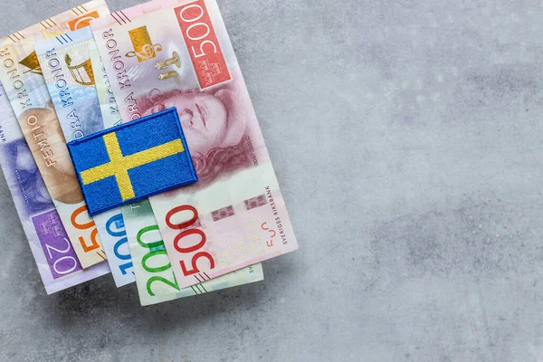 Sweden money and national emblem, Gray background, copy space, flat lay, Financial background