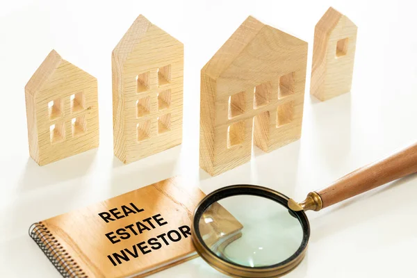 Real Estate Investor concept, Wooden blocks with the text \