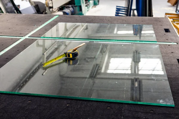 Glass workshop, Professional glass table with a glass pane, a cutting cutter and a ruler