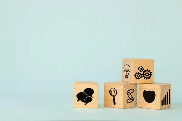 Business idea, Symbol, Conceptual icons on wooden blocks, Market observation, analysis, good team and teamwork, Customer protection, Stable growth, copy space, blue background