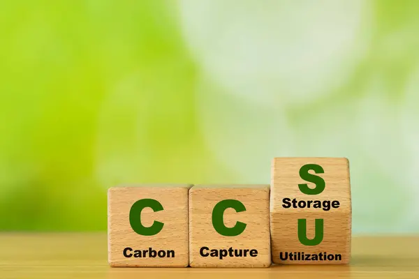 stock image Wooden cubes form the symbol CCU (carbon capture utilization) and CCS (carbon capture storage). Environmental Business concept,  Net zero action, Save energy, green energy, reduce carbon footprint