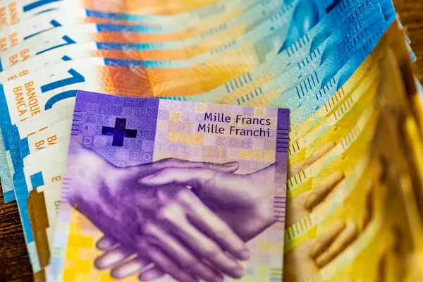 stock image Switzerland money, Large amount of spread cash and thousand Swiss francs banknote, Financial concept, close up