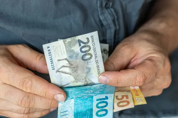 stock image Brazilian man counting money, financial concept, Brazil finance