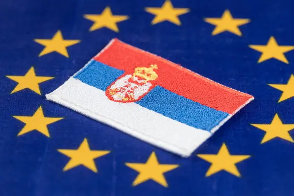 stock image Symbol of Serbia in the very center of the European Union flag, Economic community concept. Serbia's accession to the European Union