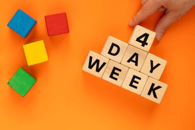 4 day week, Business concept. Hand puts wooden cube with number 4 to words Day Week. Symbol of shortening work week. written 4 day week on blocks, Beautiful orange background, close-up, copy space clipart