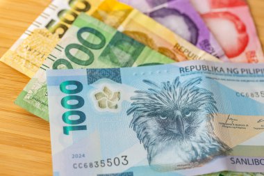 Filipinler parası. Filipin pesosu banknotları. İş ve finans kavramı. Yeni ve eski mezhepler