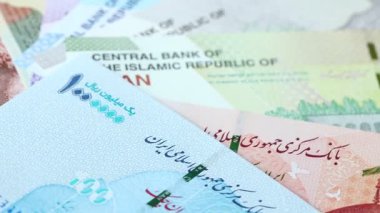 Iran money. Iranian currency exchange rate. Business concept. Iranian banknotes spinning around