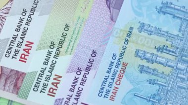 Iran money. Iranian currency exchange rate. Business concept. Iranian banknotes spinning around