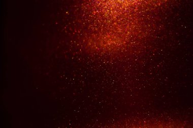 Abstract red background with sparkles and shadows. Fluidity, waves, glitter, fluid, glitter, shimmer.