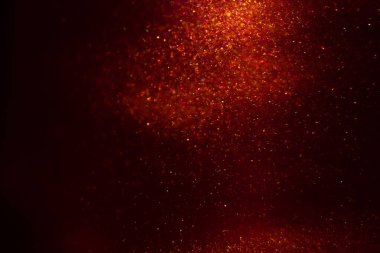 Abstract red background with sparkles and shadows. Fluidity, waves, glitter, fluid, glitter, shimmer.