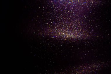 Abstract purple, magenta background with sparkles and shadows. Fluidity, waves, glitter, fluid, glitter, shimmer.