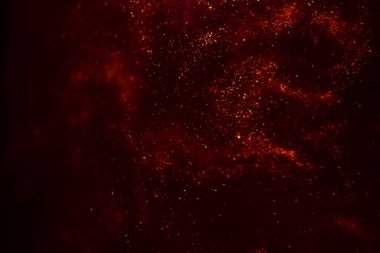 Abstract red background with sparkles and shadows. Fluidity, waves, glitter, fluid, glitter, shimmer.