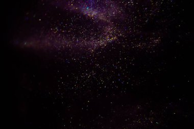 Abstract purple, magenta background with sparkles and shadows. Fluidity, waves, glitter, fluid, glitter, shimmer.