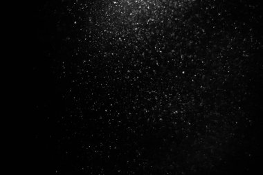 Abstract black background with sparkles and shadows. Fluidity, waves, glitter, fluid, glitter, shimmer. Stars, stardust, space, outer space, comets, placer.