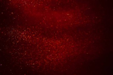Abstract red background with sparkles and shadows. Fluidity, waves, glitter, fluid, glitter, shimmer.