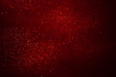 Abstract red background with sparkles and shadows. Fluidity, waves, glitter, fluid, glitter, shimmer.