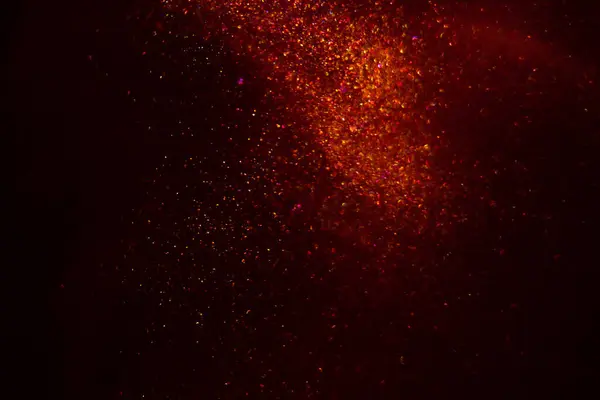 Abstract red background with sparkles and shadows. Fluidity, waves, glitter, fluid, glitter, shimmer.