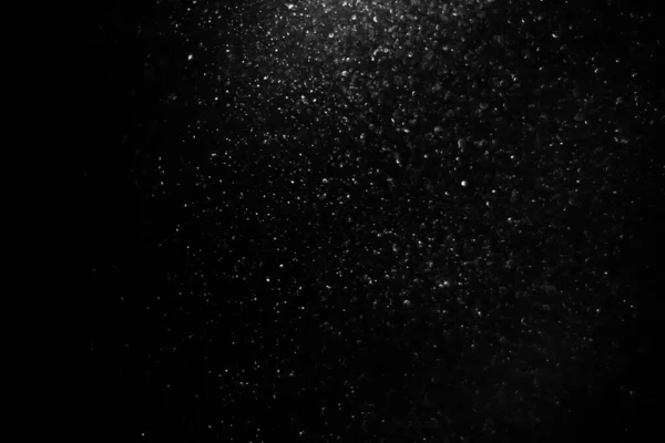 Abstract black background with sparkles and shadows. Fluidity, waves, glitter, fluid, glitter, shimmer. Stars, stardust, space, outer space, comets, placer.